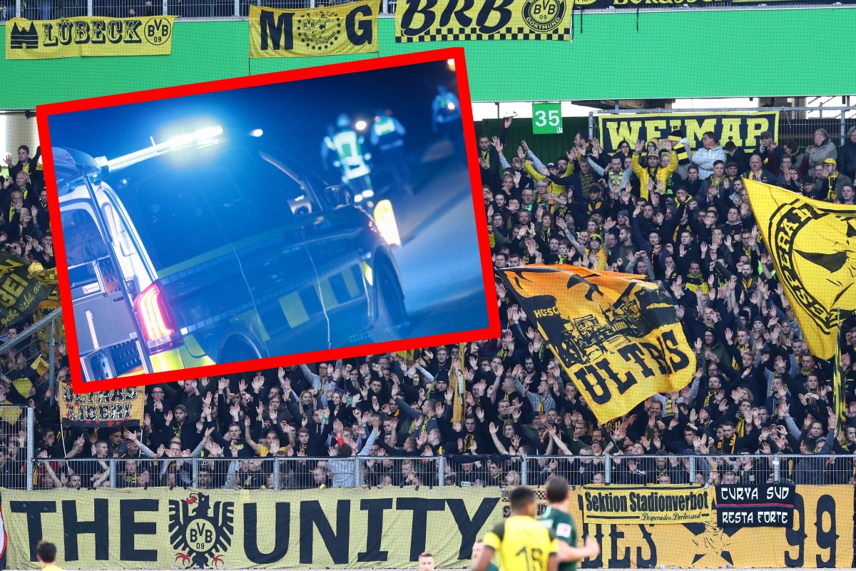 BVB-Fans und ein Polizei-Auto auf der Autobahn.